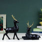 Set of 2 black deer showpieces for home and office décor, elegant addition.