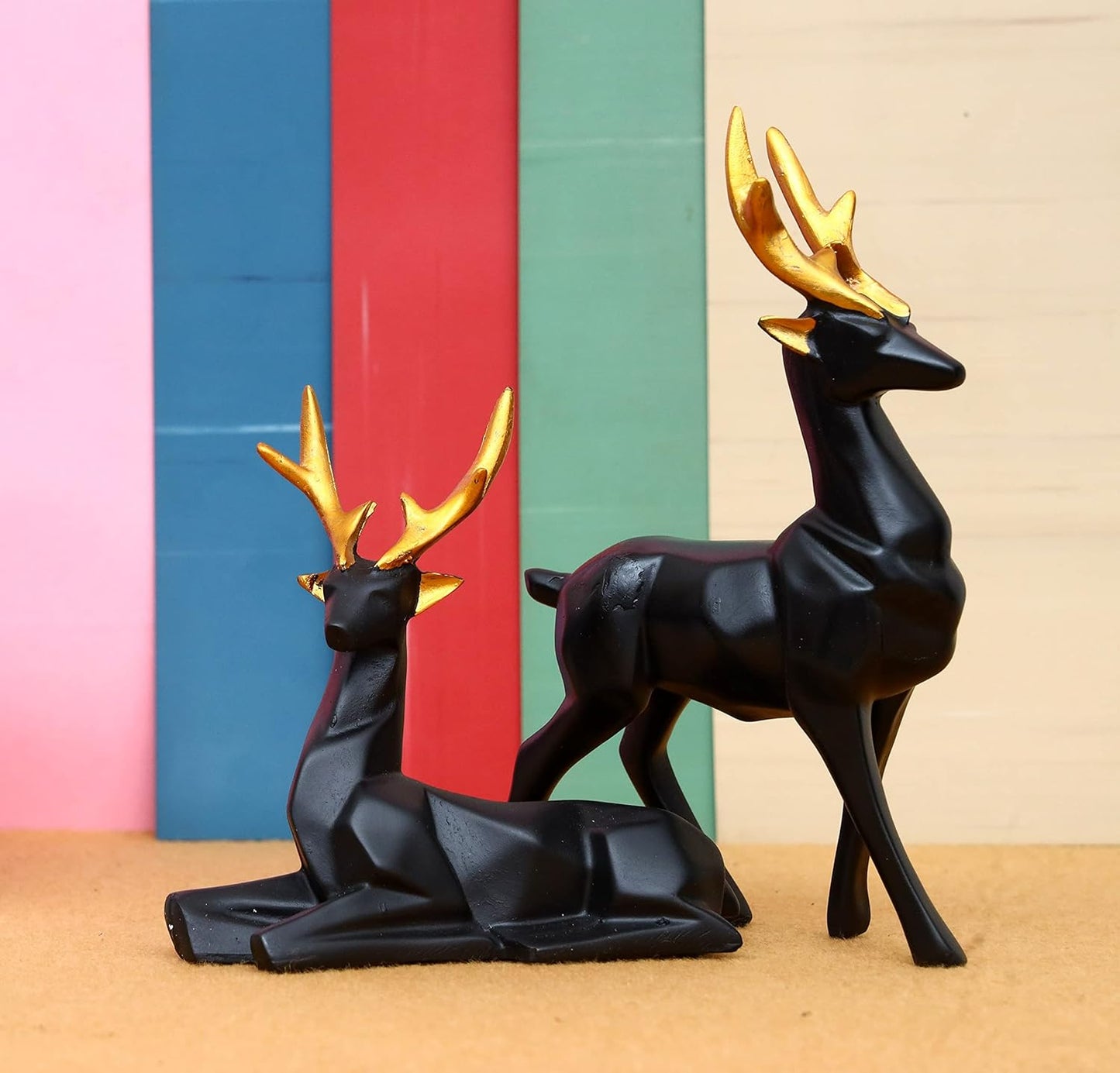 Set of 2 black deer showpieces for home and office décor, elegant addition.